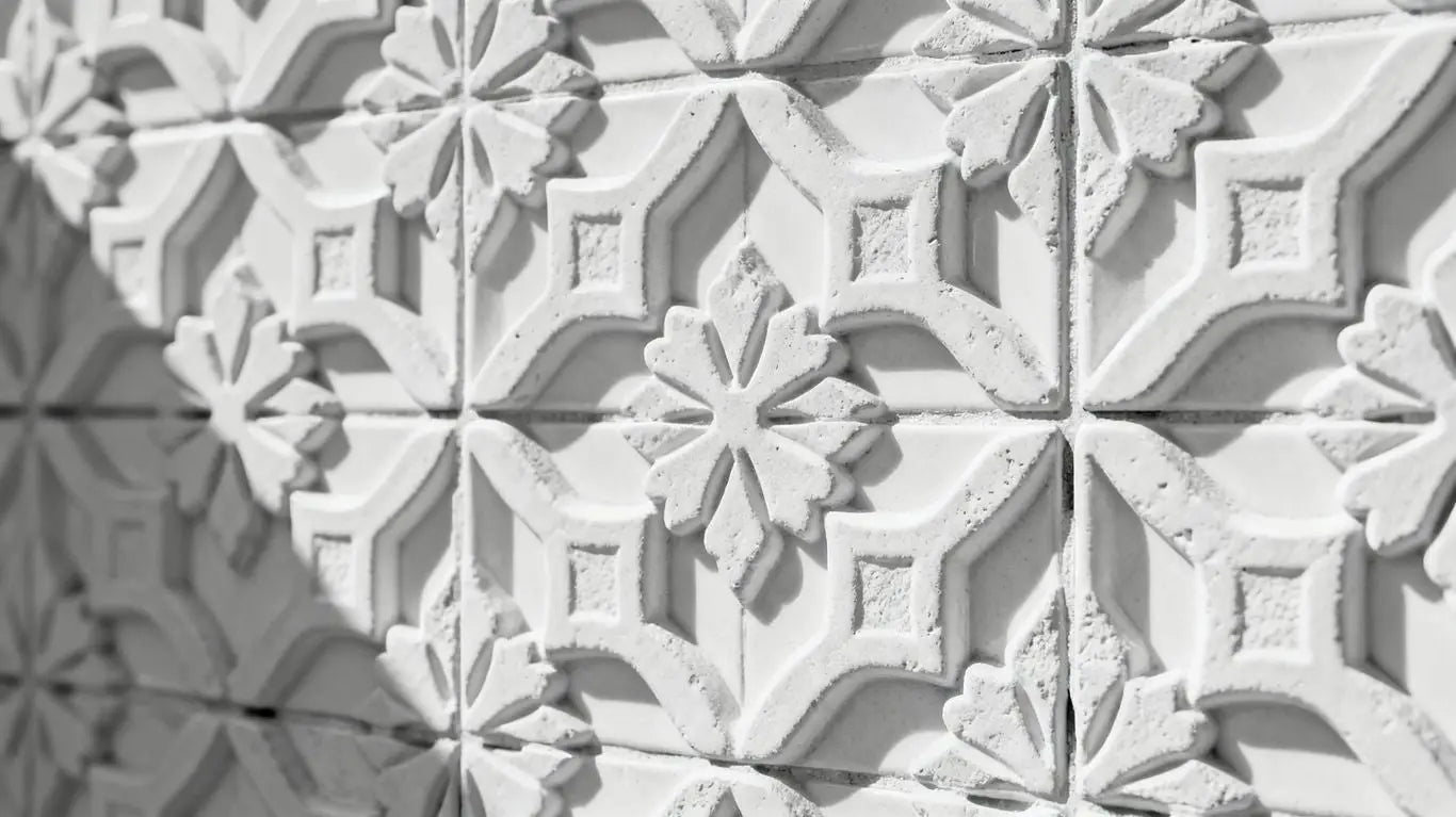 White Arabesque tiles with intricate geometric patterns.