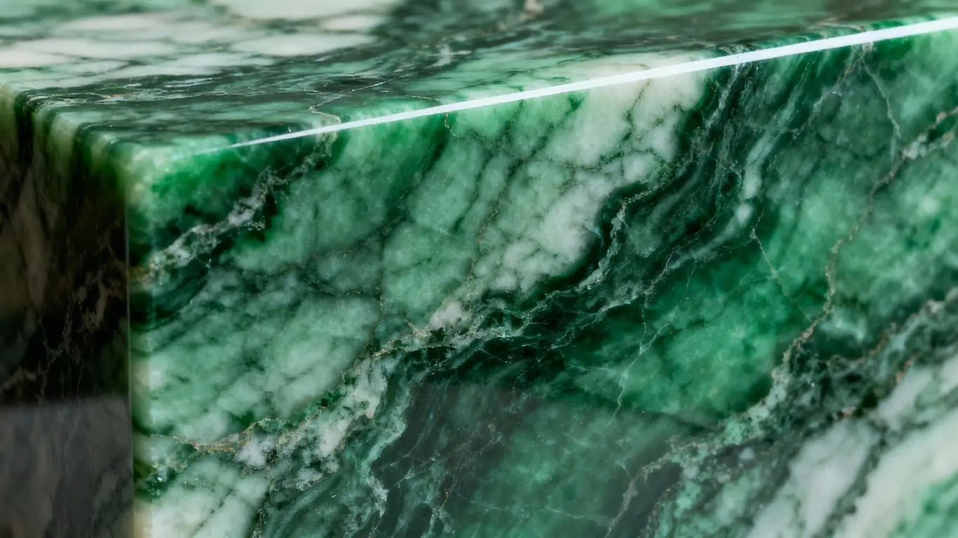 Polished Ming green marble with intricate veining.