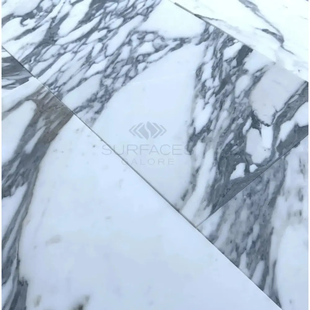 White marble tiles with prominent gray veining in Arabescato Corchia Elite 12X24 Marble Tile