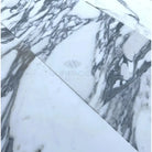 White marble tiles with prominent gray veining in Arabescato Corchia Elite 12X24 Marble Tile