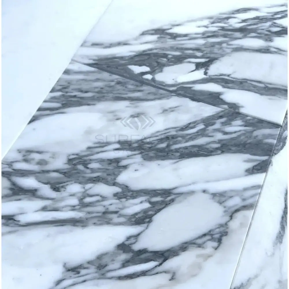 White marble surface with prominent grey veining in Arabescato Corchia Elite 12X24 Marble Tile