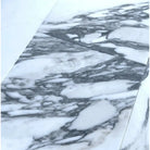 White marble surface with prominent grey veining in Arabescato Corchia Elite 12X24 Marble Tile