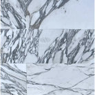 White marble tiles with prominent grey veining in Arabescato Corchia Elite 12X24 Marble Tile
