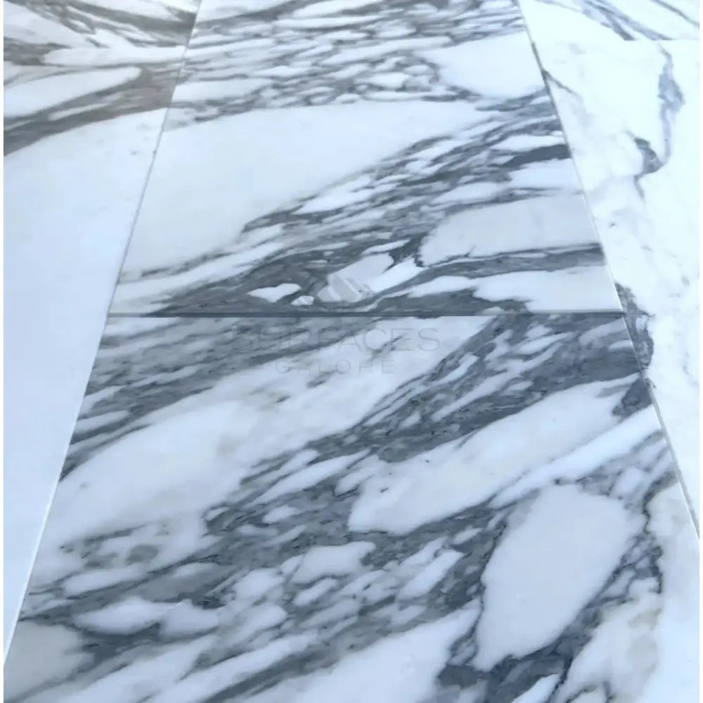 White marble tiles with prominent gray veining in Arabescato Corchia Elite 12X24 Marble Tile