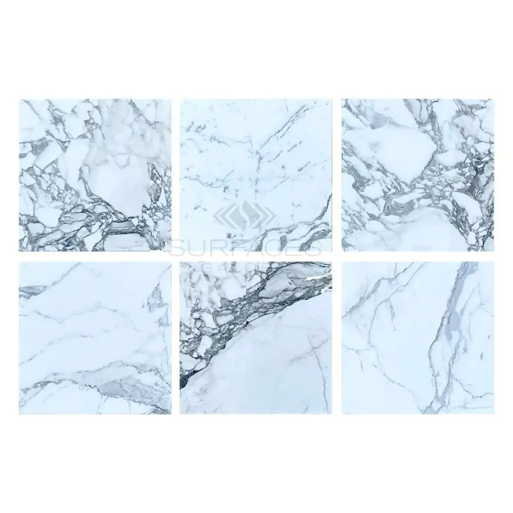 Six white Arabescato Corchia Elite 18x18 marble tiles with gray veining