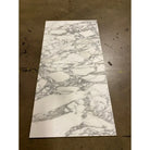 Four rectangular Arabescato Corchia Elite 18X18 marble tiles with grey veining