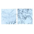 Two white marble tiles with grey veining from Arabescato Corchia Elite 18X18 collection