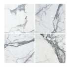 Four white Arabescato Corchia Elite 18X18 marble tiles with gray veining
