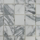 White marble mosaic tiles with grey veining in Arabescato Corchia Elite 2X2 pattern