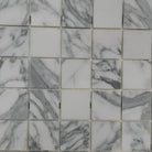 White and gray marble mosaic tiles in Arabescato Corchia Elite 2X2 pattern