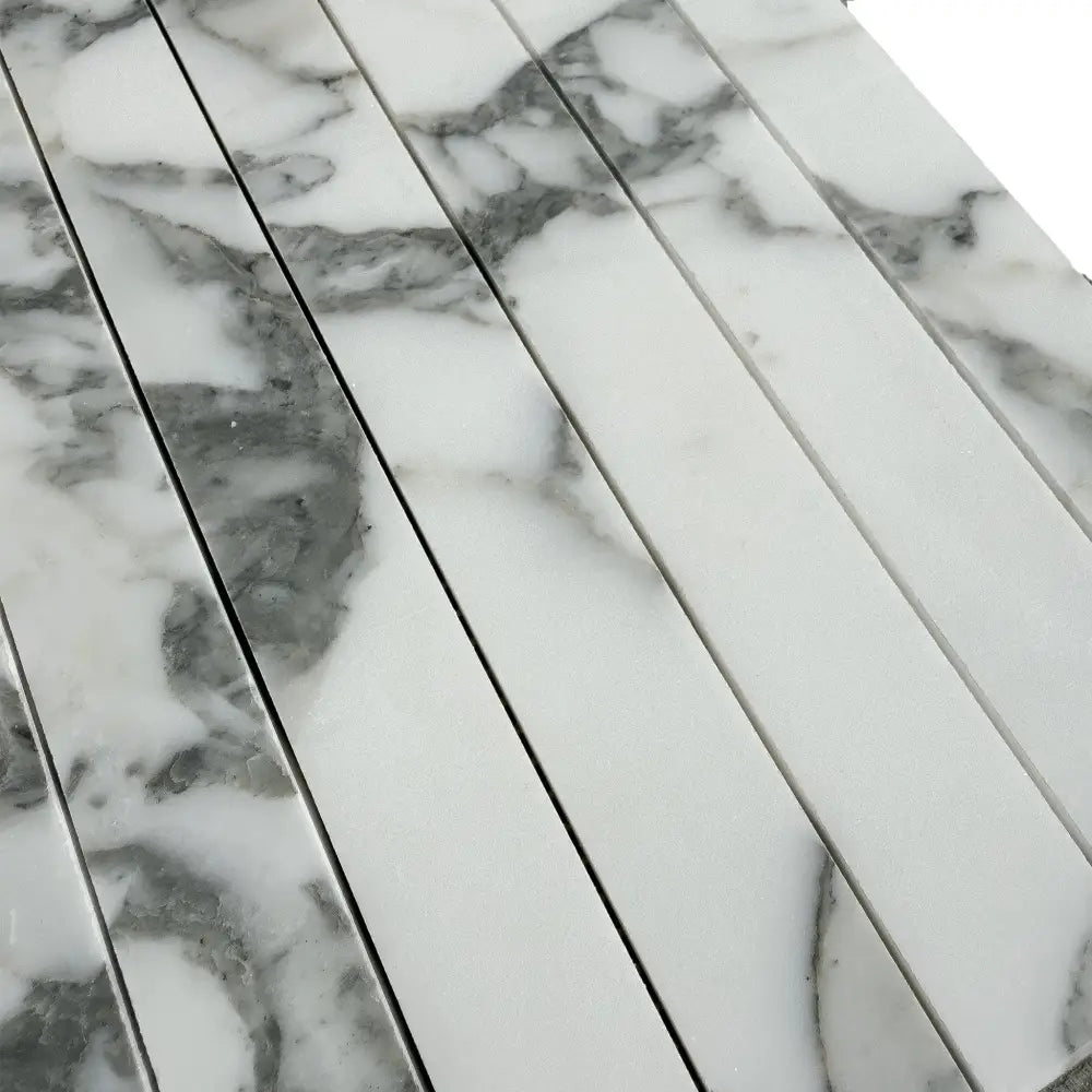 Marble-patterned rectangular tiles from Arabescato Corchia Elite Mosaic collection