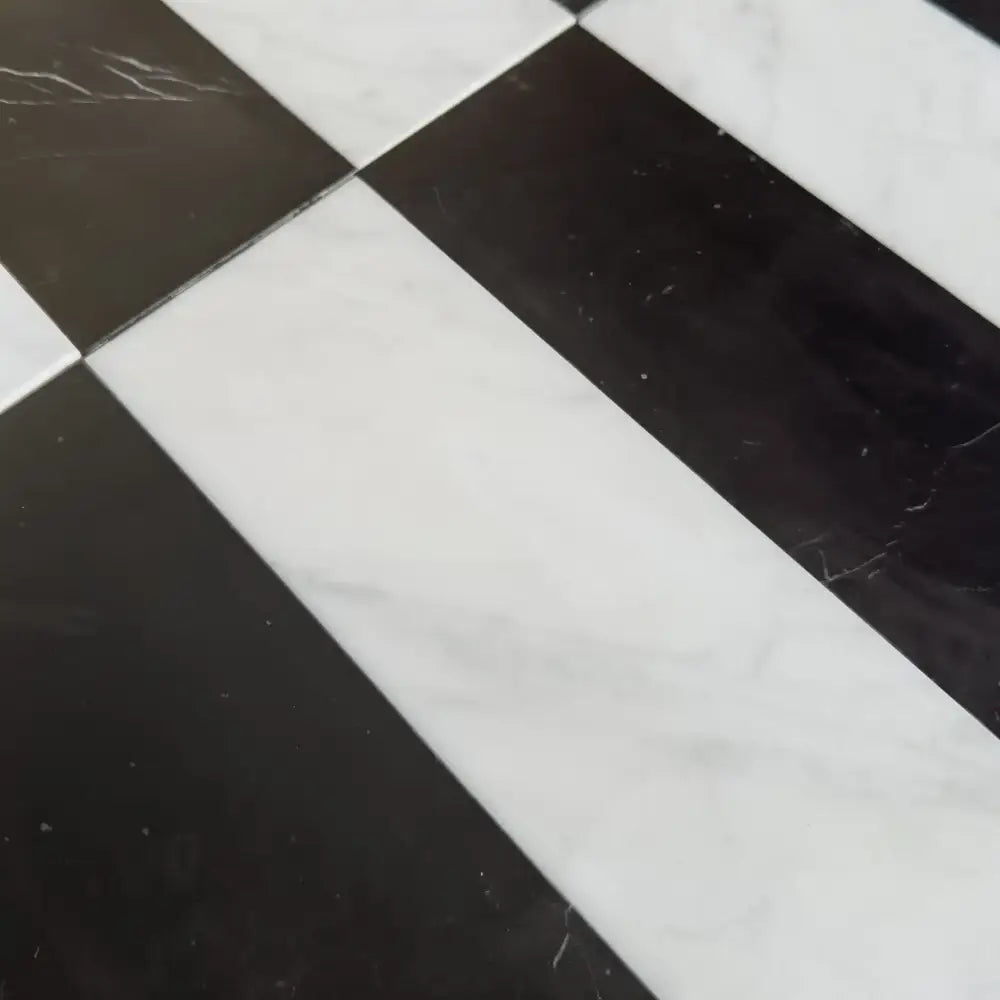 Black and white checkered floor tiles from Arezzo in Carrara White Royale and Nero Marquina Prestige 4X12 Set
