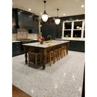 Elegant kitchen island with Calacatta Gold Select Marble Tile and marble countertop