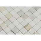 Diamond-patterned mosaic tile in Calacatta Gold Select Gold marble finish
