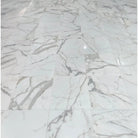 White marble tile floor from Calacatta Gold Select Gold 1X2 Brick Mosaic Marble Tile
