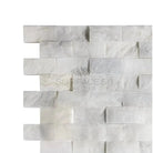 White and gray marble brick wall featuring Calacatta Gold Select mosaic tile