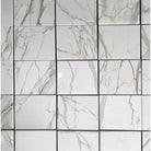 White marble tile grid featuring Calacatta Gold Select Brick Split-Faced Mosaic Marble Tile