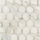 Hexagonal marble tile pattern featuring Calacatta Gold Select Gold mosaic marble tile