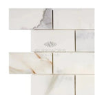 Marble-patterned subway tile from Calacatta Gold Select 2X4 Brick Mosaic collection