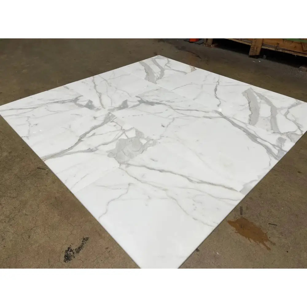 Square Calacatta Gold Select marble tile with characteristic gray veining for elegant flooring