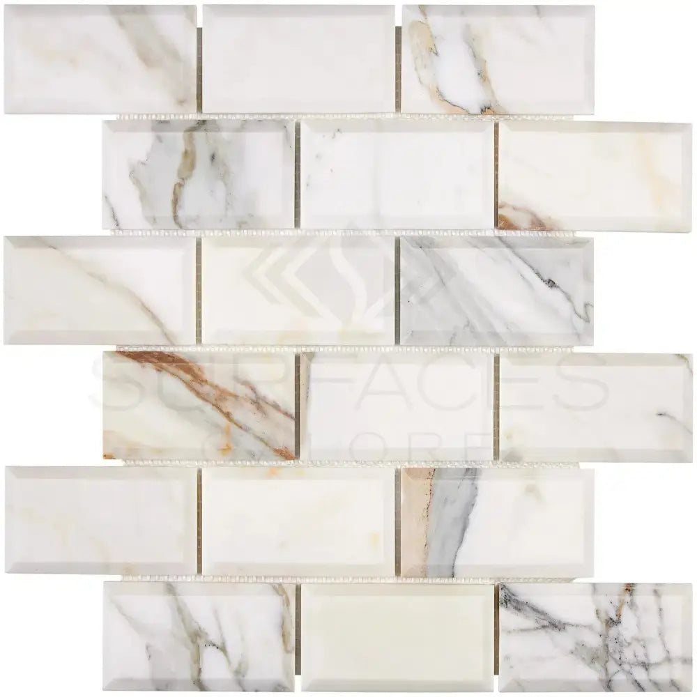 Marble-patterned rectangular mosaic tile with Calacatta Gold veining in polished and honed finish