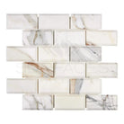 Marble-patterned glass subway tiles from Calacatta Gold Select Mosaic collection