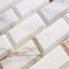 Rectangular Calacatta Gold Select marble mosaic tiles with deep-beveled edges
