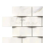 White marble brick wall with Calacatta Gold Select Gold mosaic tiles in polished or honed finish