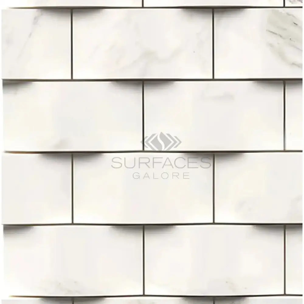 White marble brick wall featuring Calacatta Gold Select Gold 2X4 mosaic marble tile