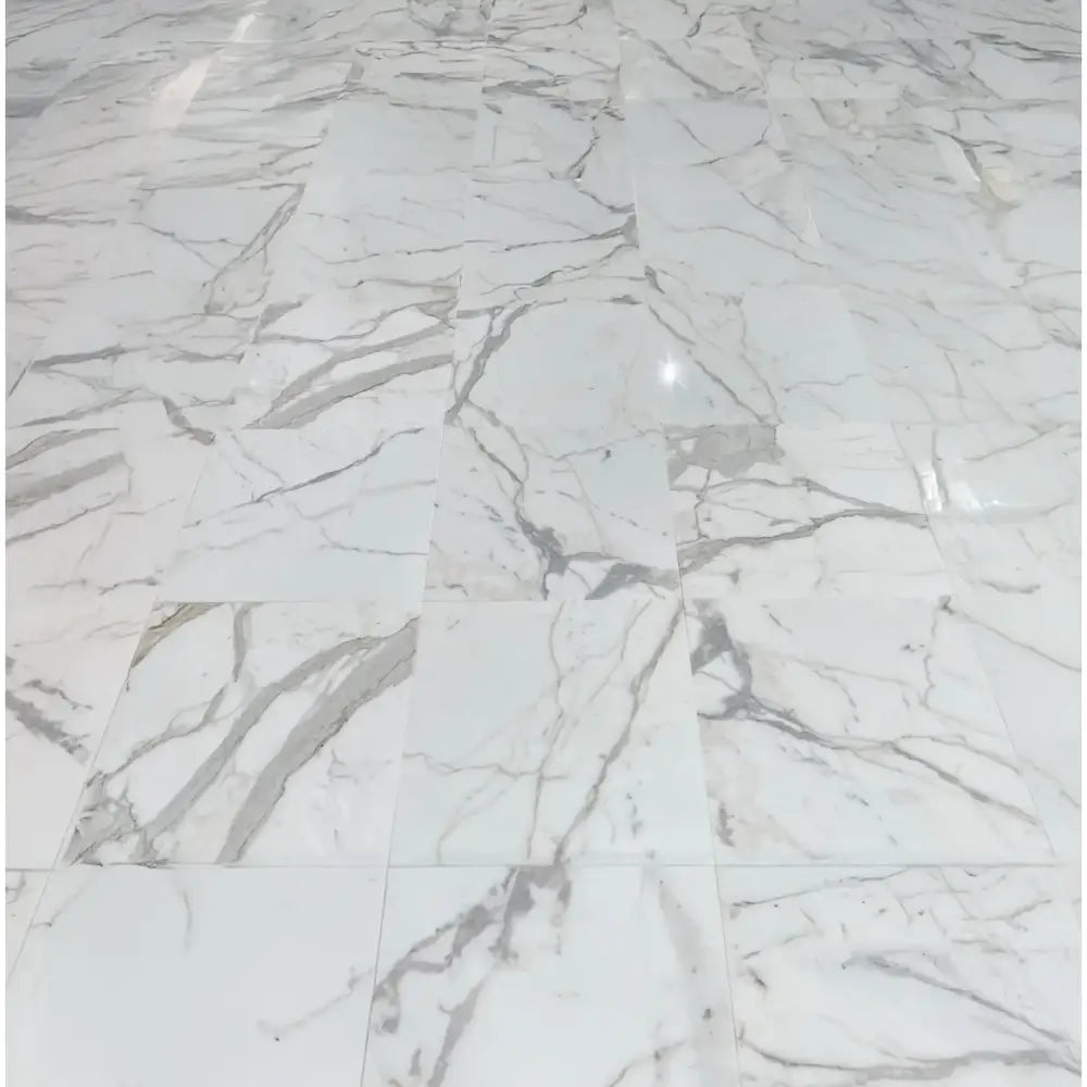 White marble tiled floor for Calacatta Gold Select Gold baseboard trim molding