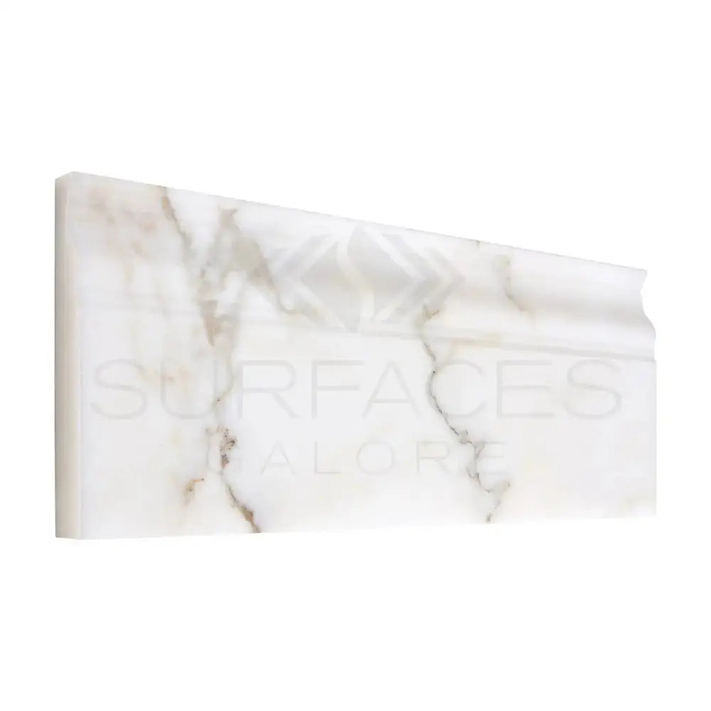 Marble-patterned decorative molding from Calacatta Gold Select Gold baseboard trim