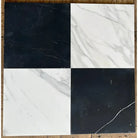 Four square Calacatta Gold marble tiles for baseboard trim in polished or honed finish