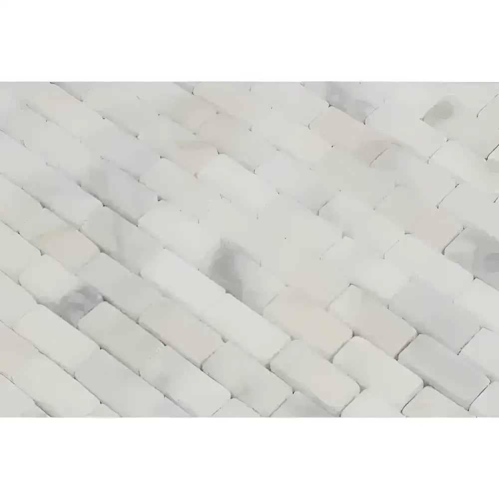 White marble herringbone tile from Calacatta Gold Select Mini-Brick Mosaic Marble Tile
