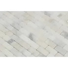 White marble herringbone tile from Calacatta Gold Select Mini-Brick Mosaic Marble Tile