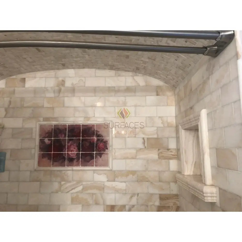 Tiled bathroom interior featuring Calacatta Gold Select Mini-Brick Mosaic Marble Tile