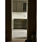 Olive green kitchen cabinetry with Calacatta Gold Select Mosaic Marble Tile