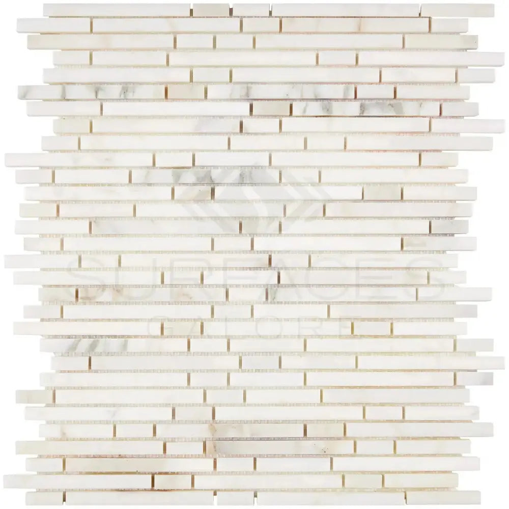 White marble mosaic tile featuring Calacatta Gold with gold bamboo sticks for luxurious interiors