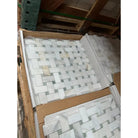 Boxes of white and gray Calacatta Gold Select Basketweave Marble Mosaic Tiles