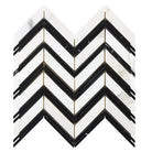 Chevron patterned tile mosaic in Calacatta Gold Select Gold with black accents