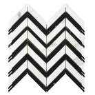 Chevron patterned Calacatta Gold marble mosaic tile with black accents
