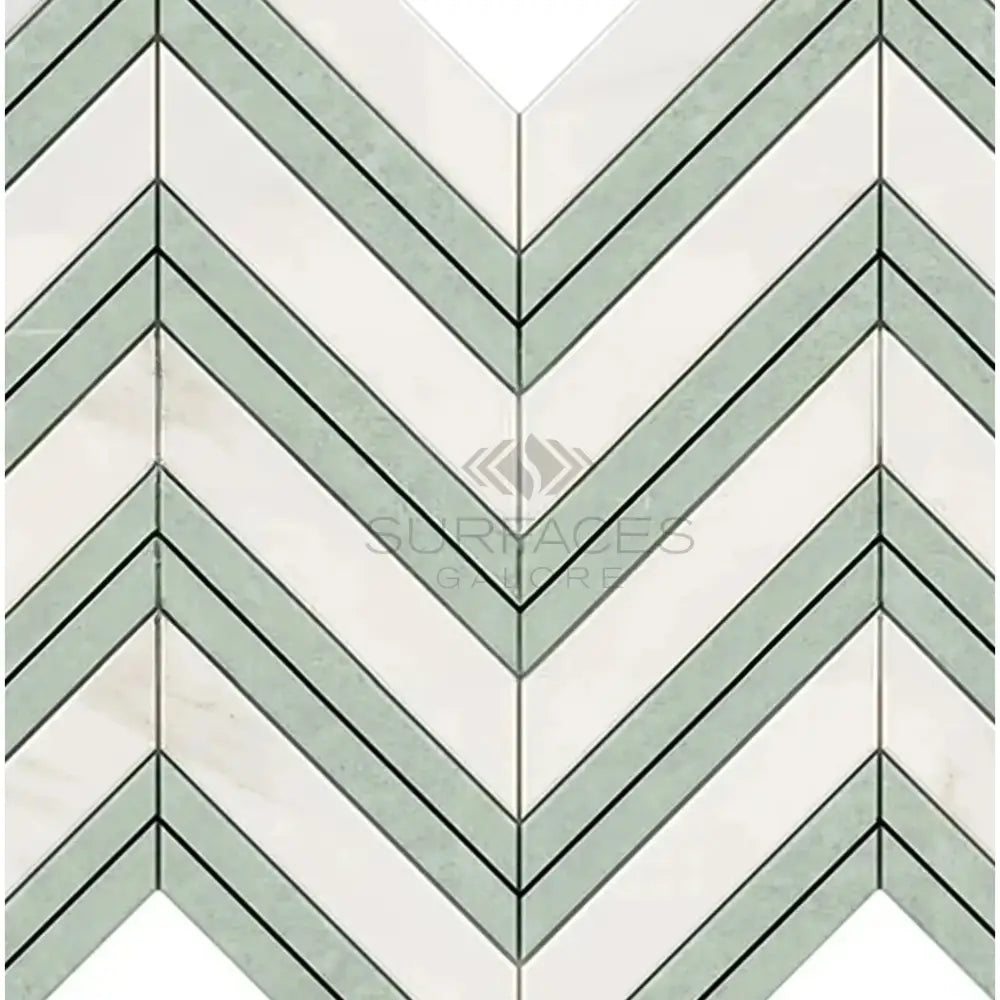 Chevron patterned marble tile in Calacatta Gold with Ming-Green accent for luxurious design