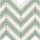 Chevron patterned marble tile in Calacatta Gold with Ming-Green accent for luxurious design