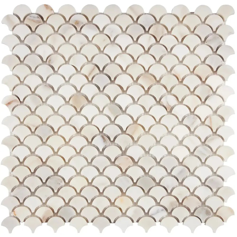 Scalloped marble mosaic tile from Calacatta Gold Select Gold Fan Raindrop collection