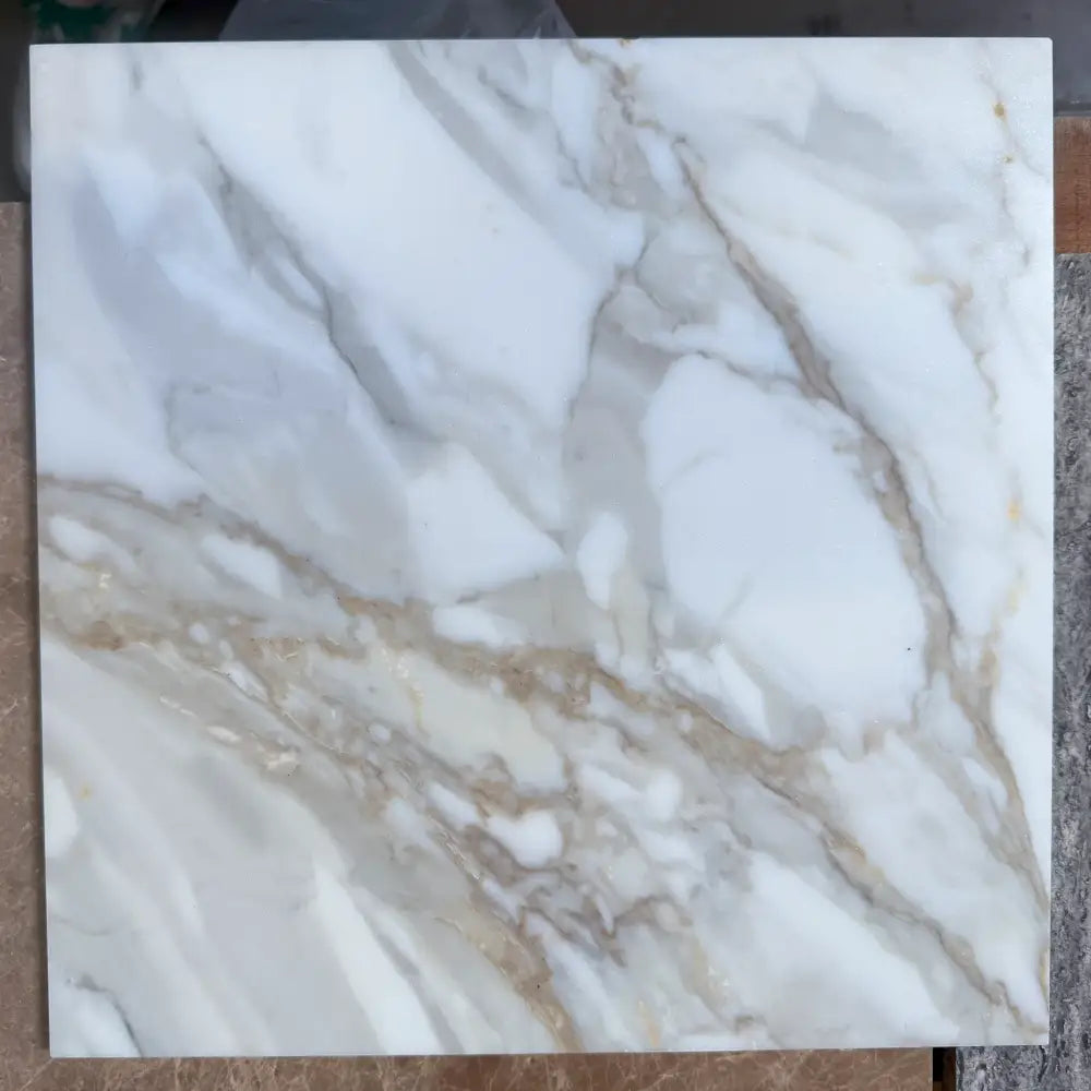 Square Calacatta Gold Select marble tile with gold veining in 12x12 polished or honed finish