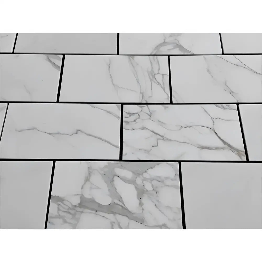 White Calacatta Gold marble tiles with dark grout for elegant flooring or walls