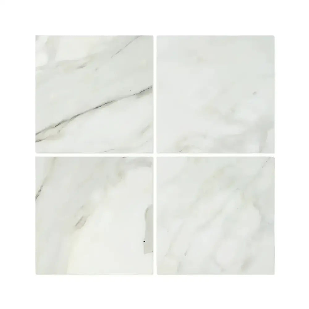 Four Calacatta Gold Select marble-patterned tiles in polished finish