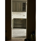Olive green kitchen cabinets with Calacatta Gold Select Gold Marble 18x18 tiles