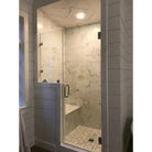 Modern marble shower stall featuring Calacatta Gold Select Gold Marble 24x24 tiles