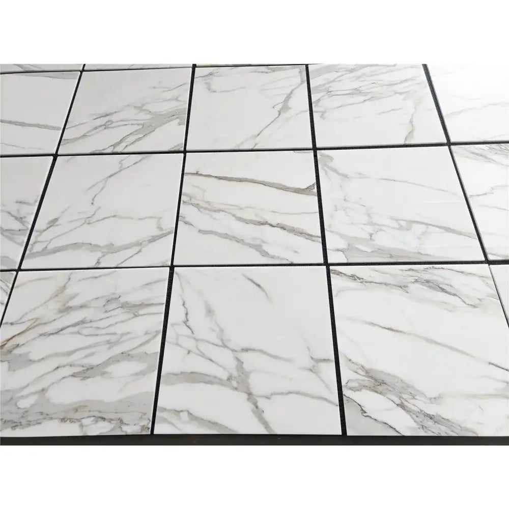 White marble-patterned tile floor from Calacatta Gold Select Gold Marble 24X24 collection