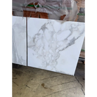 White marble-patterned tiles from Calacatta Gold Select 24x24 polished or honed finish